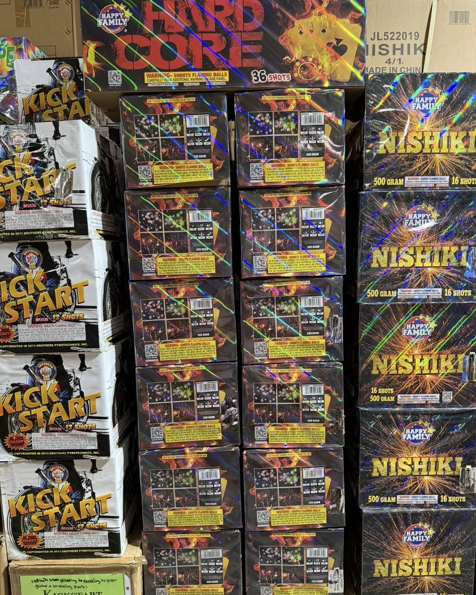 Hard Core, Nishiki, and Kick Start fireworks stacked in the showroom